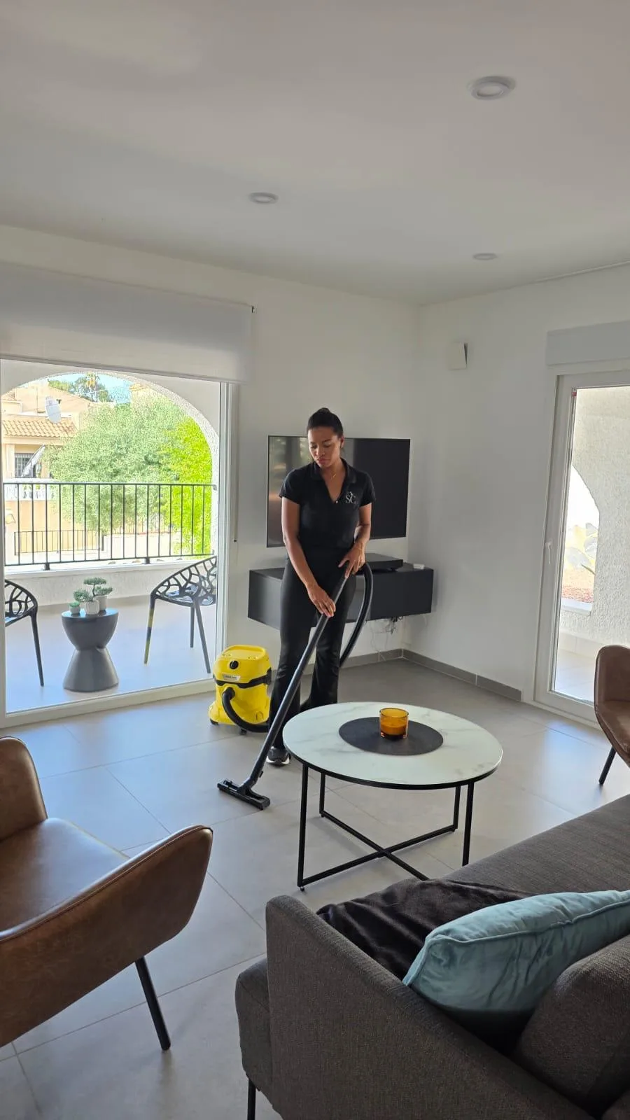 SplendidaClean operative vacuuming a bright modern villa living room in Orihuela Costa